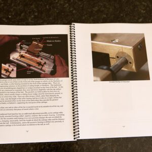 A book open to show the parts of a woodworking machine.